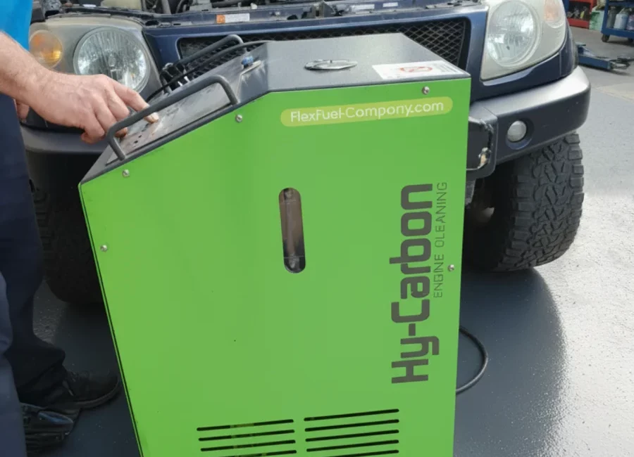 Hy-Carbon engine decarbonization service to remove carbon buildup from a car's engine with the hood open